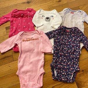 Set of 5 newborn long sleeve onesies.